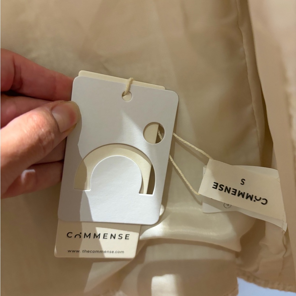 Commense Cream Beige Jacket Tag Display - Picture 2 of 3